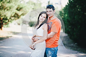 Happy couple posing in the park