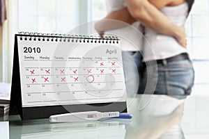 Happy couple with positive pregnancy test