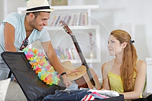 happy couple preparing for travel vacation together