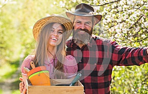 Happy couple ranch owners. Ecology environment. Soils and fertilizers. Planting plants. Family farm. Organic farm