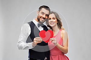 Happy couple with red heart on valentines day