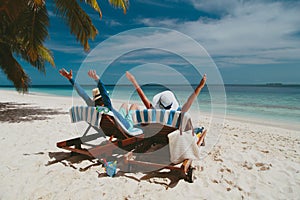 Happy couple relax on a tropical beach