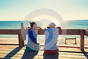 Happy couple relaxes on a bungalow veranda