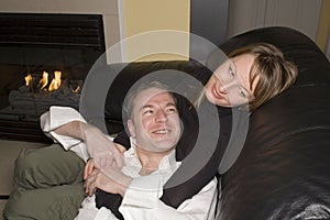 Happy couple relaxing on couch