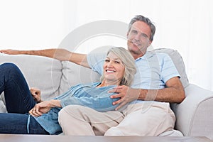 Happy couple relaxing at home