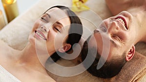 Happy couple relaxing in spa salon