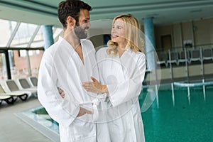 Happy couple relaxing at wellness spa center