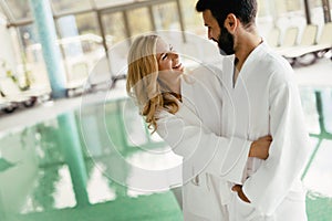 Happy couple relaxing at wellness spa center