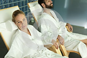 Happy couple relaxing at wellness spa center