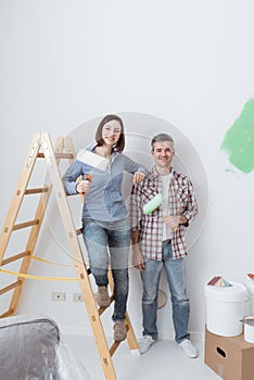 Happy couple renovating their home