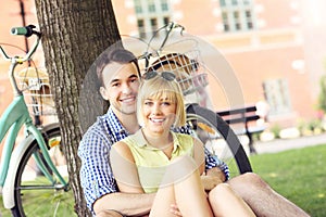 Happy couple resting in the park photo