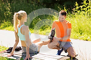 Happy couple with rollerblades outdoors