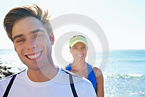 Happy couple, runners and portrait in beach, workout and fitness with smile, training and outdoor for run. Man, woman