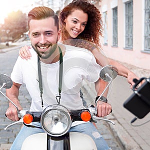 Happy couple traveling on motorcycle.Travel concept