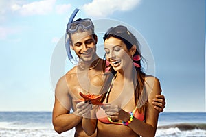 Happy couple with sea star