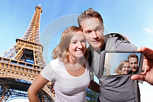 Happy couple selfie in Paris