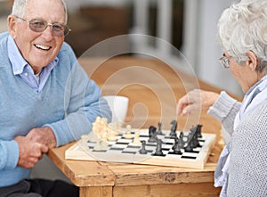 Happy, couple and senior in game of chess together to relax in retirement on holiday or vacation. Elderly, man of woman
