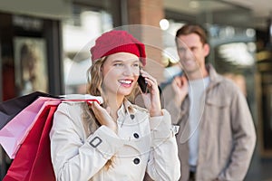 A happy couple with shopping bags