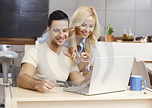 Happy couple shopping online