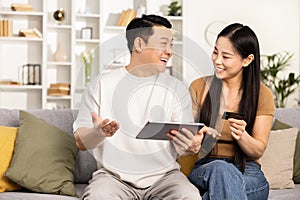 Happy Couple Shopping Online Together With Tablet