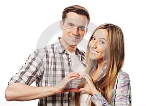 Happy couple showing heart with their fingers
