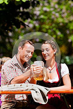 Happy Couple sitting in Beer garden