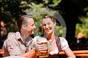 Happy Couple sitting in Beer garden