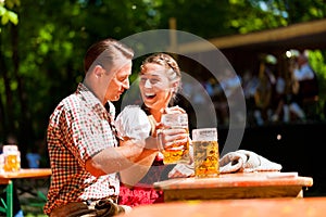 Happy Couple sitting in Beer garden
