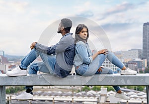 happy couple sitting in front of the city Sheffield and take photos on great day