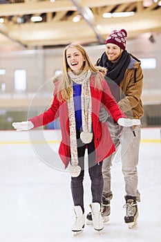 Happy couple on skating rink