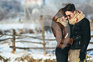 Happy couple in snow park