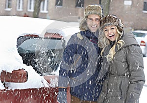 Happy couple in snowfall