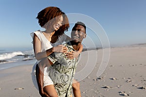 Happy couple spending time together on the beach