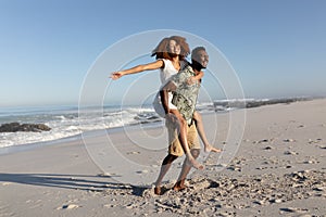 Happy couple spending time together on the beach