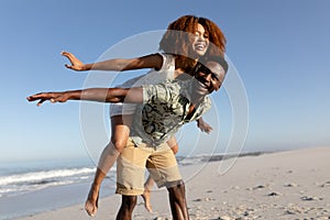 Happy couple spending time together on the beach