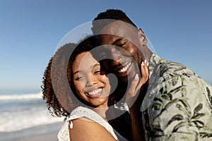 Happy couple spending time together on the beach