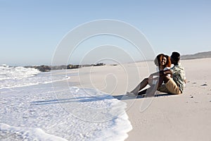 Happy couple spending time together on the beach