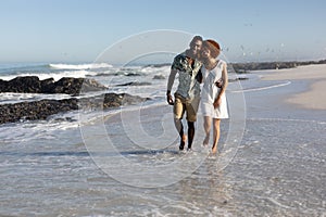 Happy couple spending time together on the beach