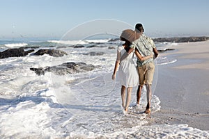 Happy couple spending time together on the beach