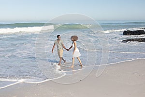 Happy couple spending time together on the beach