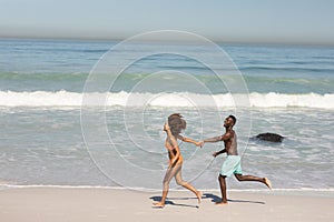 Happy couple spending time together on the beach