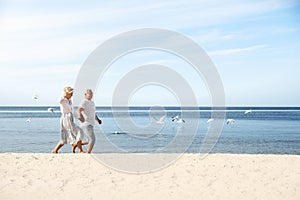 Happy couple spending time together on sea beach