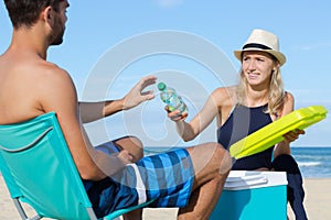 happy couple standing on shore