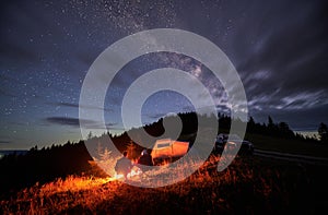 Happy couple staring at starry sky