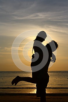 Happy Couple on Sunset Beach - Silhouette