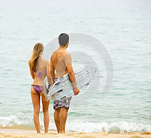 Happy couple with surf boards