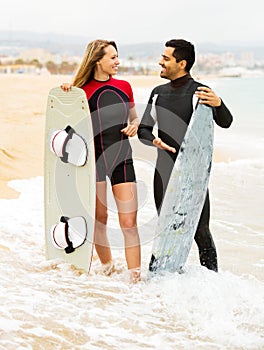 Happy couple with surf boards