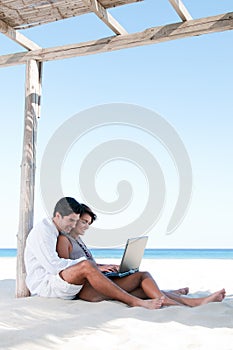 Happy couple surfing the net outdoor