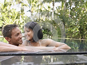 Happy Couple In Swimming Pool