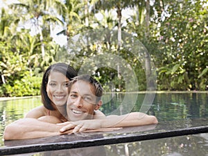 Happy Couple In Swimming Pool